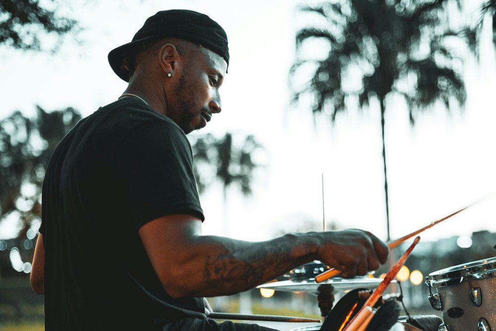 Drummer playing live at open-air concert