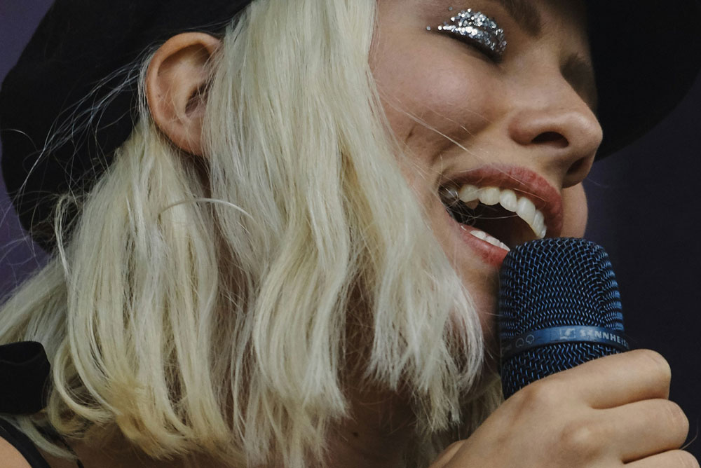 Female vocalist singing in to the microphone